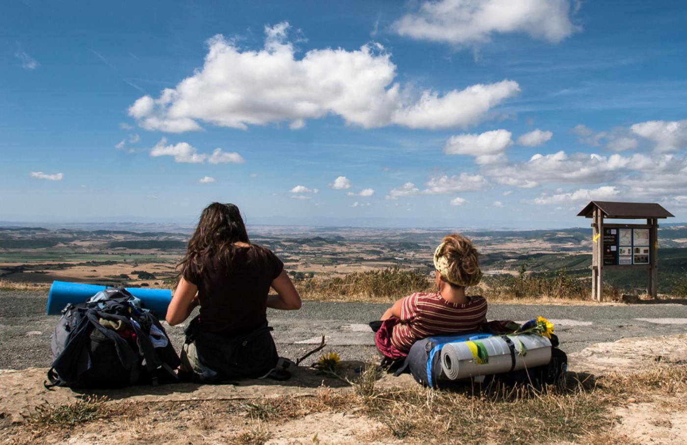 Pilgrim resting in the Alto del Perdón